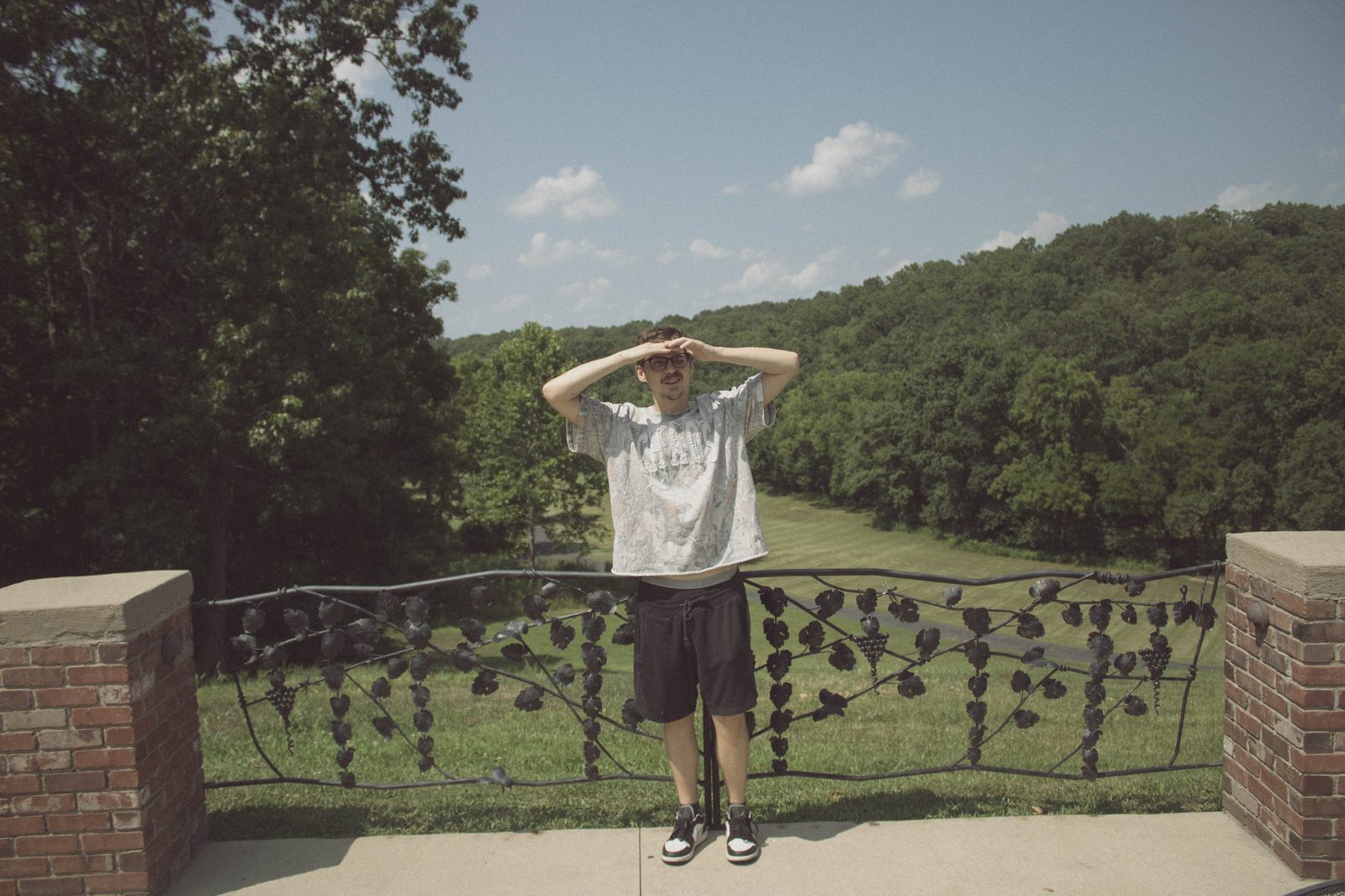 04Riley shielding his eyes at the overlook, Lake of the Ozarks